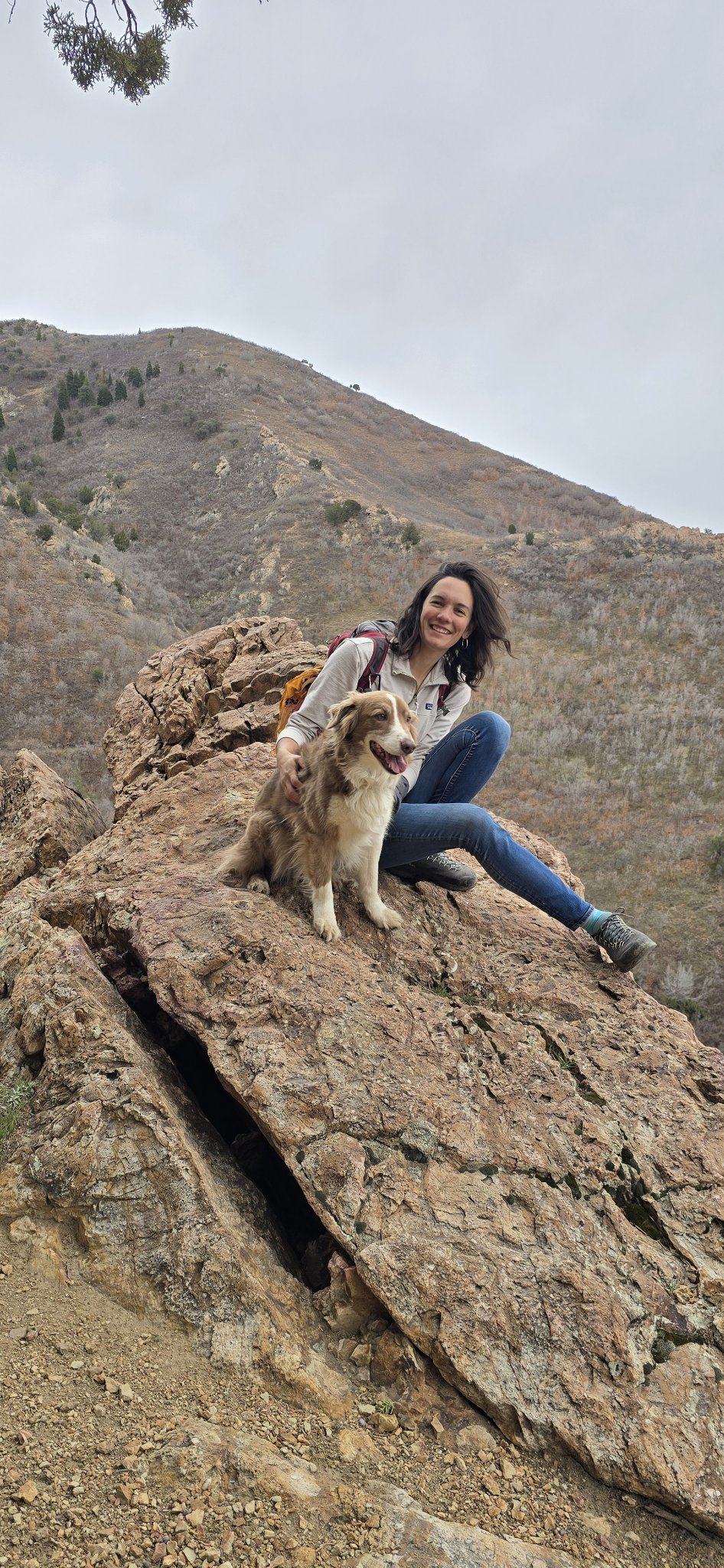 Kelly with her dog on a summit